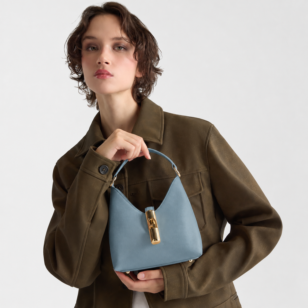 Women’s Furla Iride Mini Bag
WE00876_ARE000_1007_4355S Cloud Blue lifestyle view
